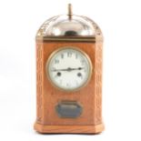 An oak case mantel clock