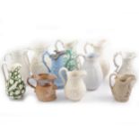 Eleven assorted Victorian decorative jugs