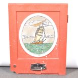 Wooden door panel, oval leaded glass panel of a sailing ship,
