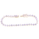 Effy -Tanzanite trillion cut tennis bracelet.