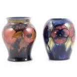 Moorcroft Pottery 'Pomegranate' and 'Pansy' vases.