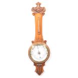 Carved walnut aneroid barometer,