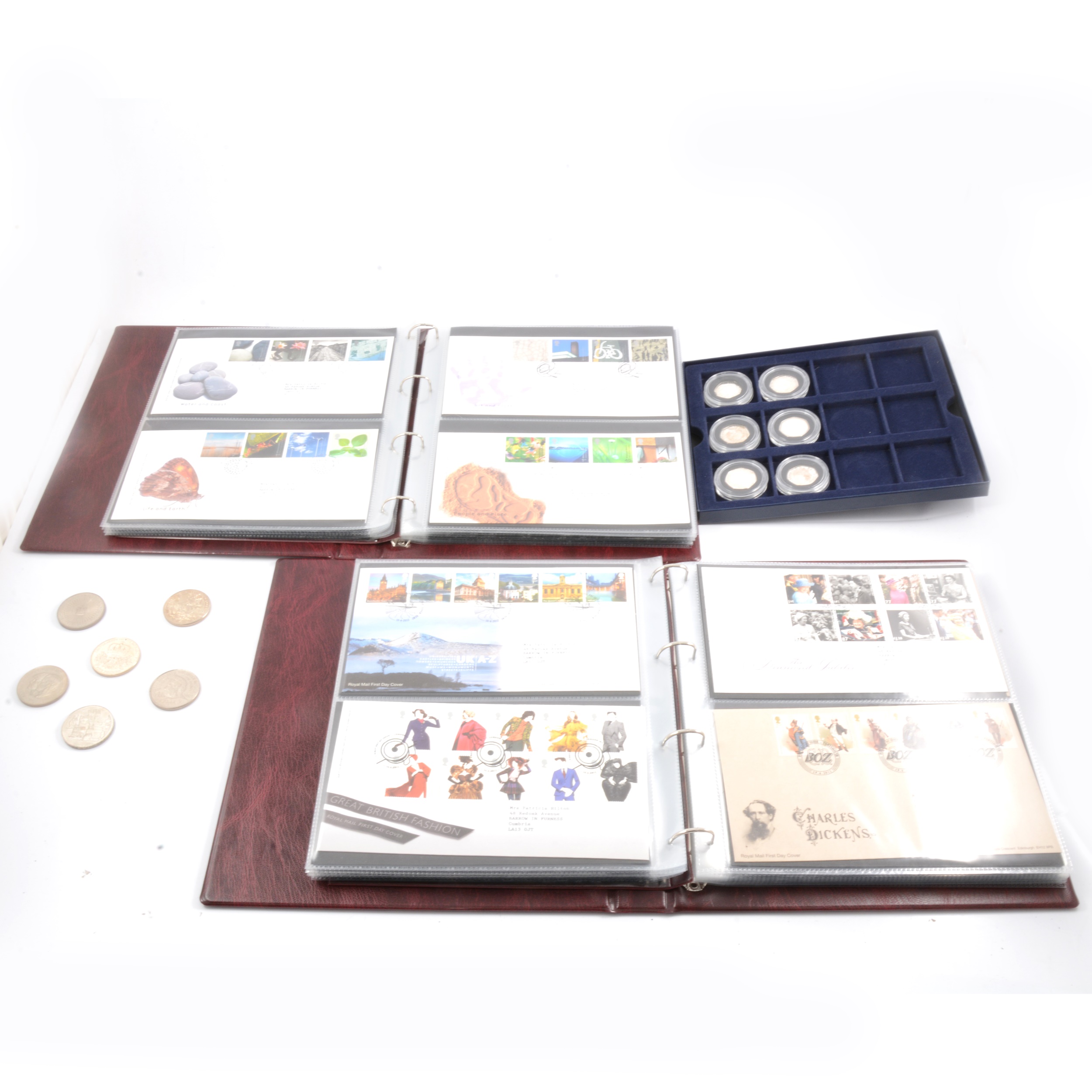 Collection of modern commemorative coins and first day covers.