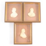 Three wax busts of Classical figures, framed.