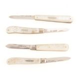 Four mother-of-pearl and silver folding fruit knives.