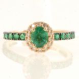 Effy - An oval emerald and diamond cluster ring.