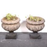 Pair of reconstituted stone garden urns,