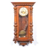 A walnut and stained beechwood Vienna wall clock,