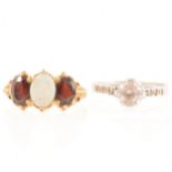 Two gold dress rings, opal and garnet, solitaire synthetic clear stone.