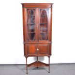 Late Victorian mahogany freestanding corner cabinet on stand