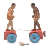 A pair of early 20th century tin-plate boxing figures