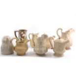 Eight Victorian buff stoneware relief-moulded jugs.