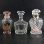 Cut-glass and silver-mounted decanter, and two others