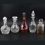 Ruby glass enamelled decanter and four others.