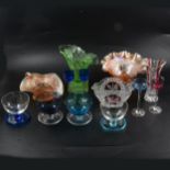 Multicoloured glass ice cream dessert bowls, wine and liqueur glasses, and other glasswares.