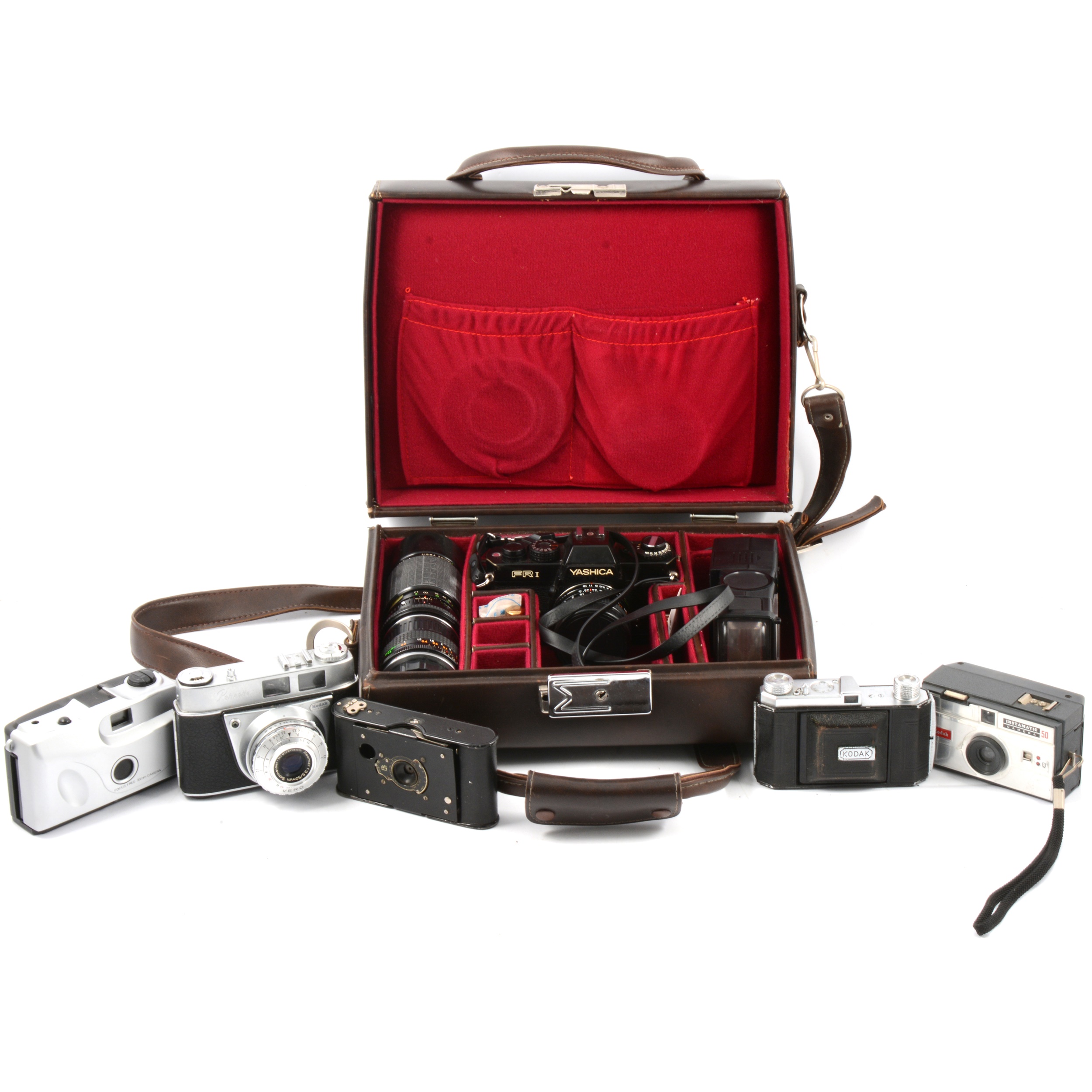 Vintage film cameras and accessories, including Yashica FR1 with two lenses and flash, cased