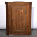 Georgian style oak hanging corner cupboard,