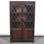 Two stained oak glazed bookcases and an open bookcase