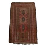 Afghan rug and an old prayer rug.