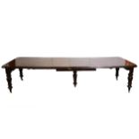 Victorian mahogany extending dining table, with five leaves