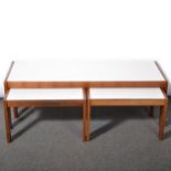 Nest of three Danish teak and melamine coffee tables