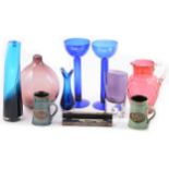 Blue glass vases, red glass jug, and other ceramics and glassware.