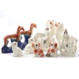 Pair of Staffordshire greyhounds with rabbits, pair of flat back figures on horseback and dogs.