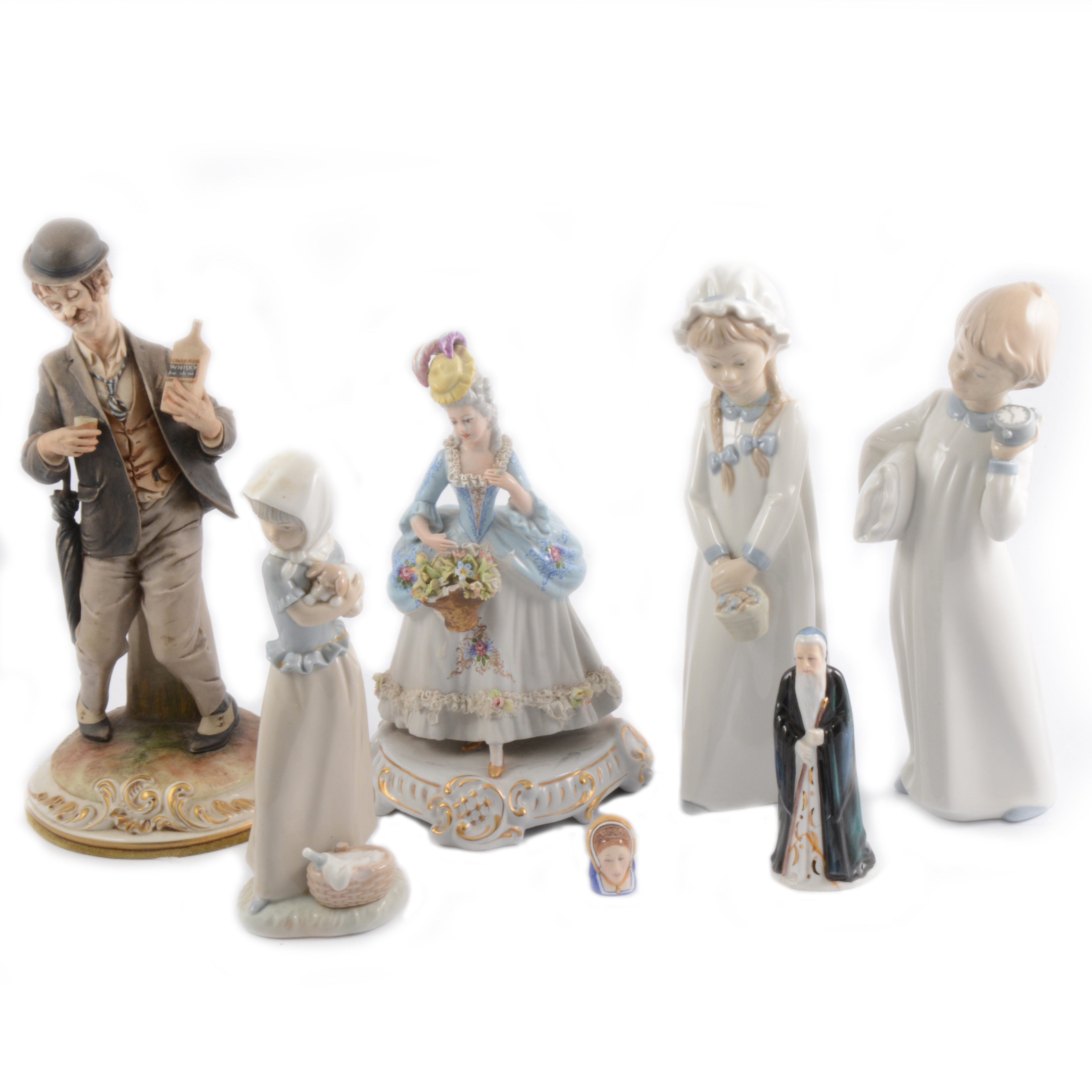 Seven ceramic figures including Nao and Capodimonte