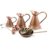 Set of copper frying pans, jugs and ladles.