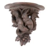 Black Forest carved wood wall bracket,