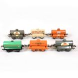 Six Hornby O gauge model railway tank wagons.