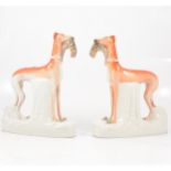 A pair of large Staffordshire models of Greyhounds