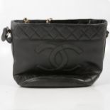 Chanel - a lady's 1960's vintage black leather handbag.