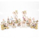 Two Meissen Marcolini type figural candlesticks, and other ornaments,