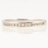 A platinum diamond half eternity ring.