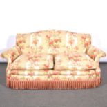 A pair of traditional two-seater settees,