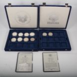 Five presentation cases of mainly silver coins.