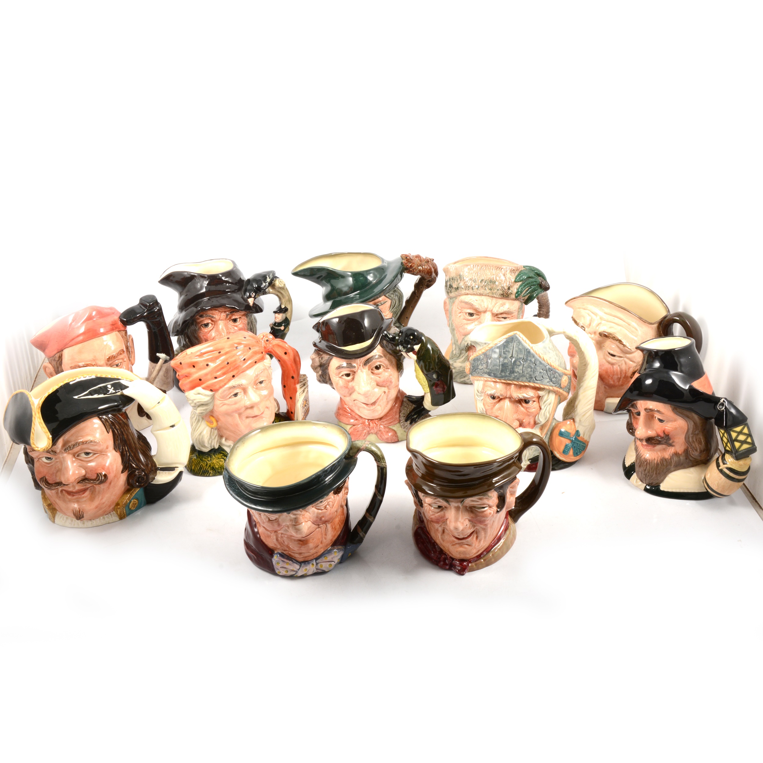 Twelve Royal Doulton character jugs.