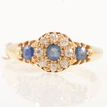 A sapphire and diamond cluster ring.