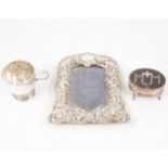 Silver photograph frame, tortoiseshell and silver ring box, and christening mug.
