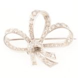 A ribbon bow diamond set brooch,