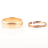 An 18 carat yellow gold wedding band and one other.