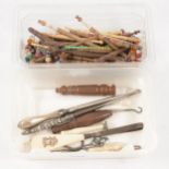 Bone and wooden pillow lace bobbins, button hooks for boots and gloves, treen needle cases.