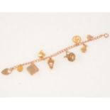 A 9 carat rose gold charm bracelet with eight charms.