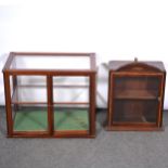 "The Humistor" counter top cigar display case, and a wall cabinet,