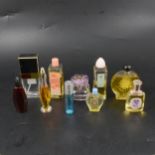 Two trays of miniature vintage perfume bottles.