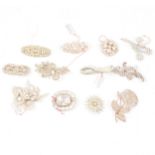 Twelve vintage clear paste set brooches.