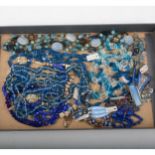 One tray of vintage glass, bakelite and celluloid jewellery with a blue tone.