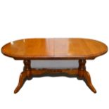 Contemporary oak and mahogany banded dining suite,