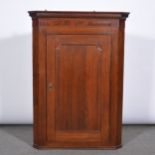 Oak and mahogany banded hanging corner cupboard.